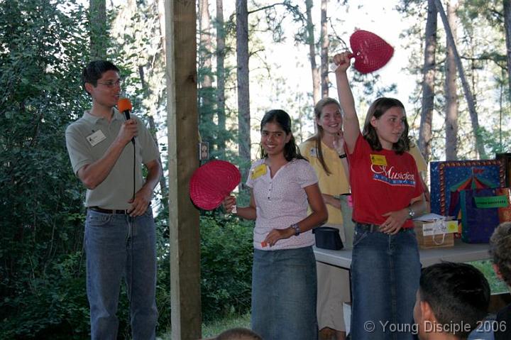 08 At orientation, the Camp Director, Mr. Ted, and the head boys' and girls' counselors go over the rules of camp. You might even win a prize like these girls did!