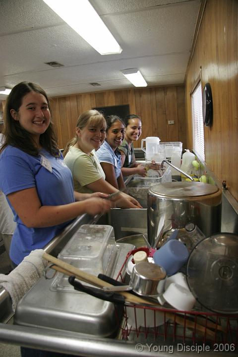 36 Of course, after lunch, there are dishes to do again! This time, a girls' unit tackles the pile.