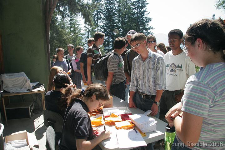 76 On Sunday, after a farewell service, the campers line up to check-out. The week of camp was great, and now it's time to go home.