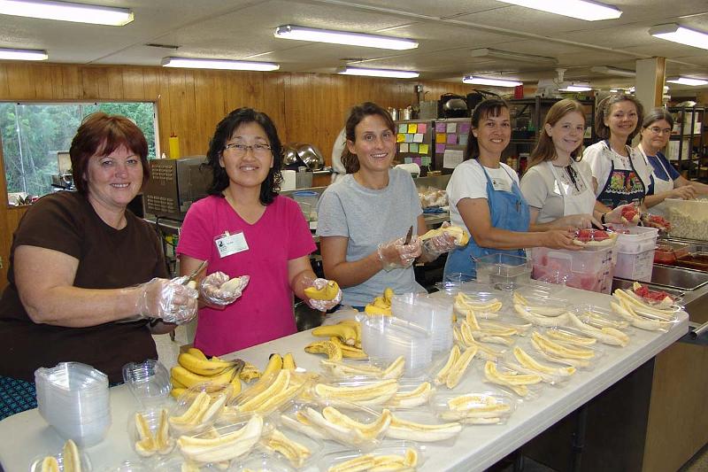 DSC01186.JPG - Thursday night is banana splits! The lovely kitchen staff get ready to serve the hungry campers.