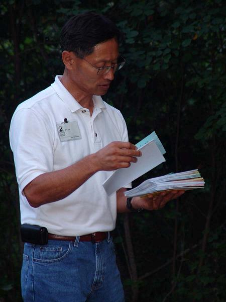DSC08863.JPG - It is always nice to hear from home. Mr. Kim hands out letters during the daily mail call.